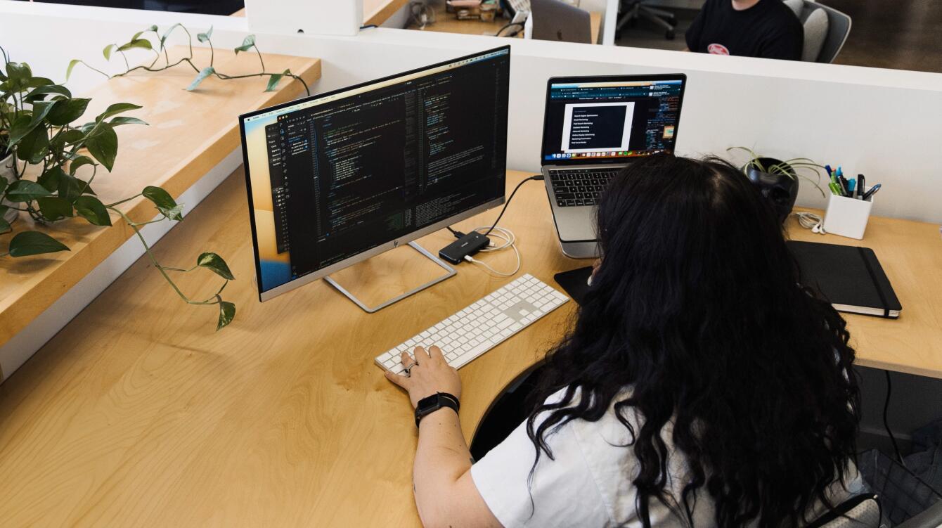 person working at computer in VS code